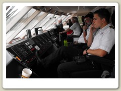 Lots of crew members in the wheelhouse