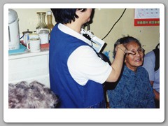 Yvonne (tour guide) visiting local family in high-rise apartment building